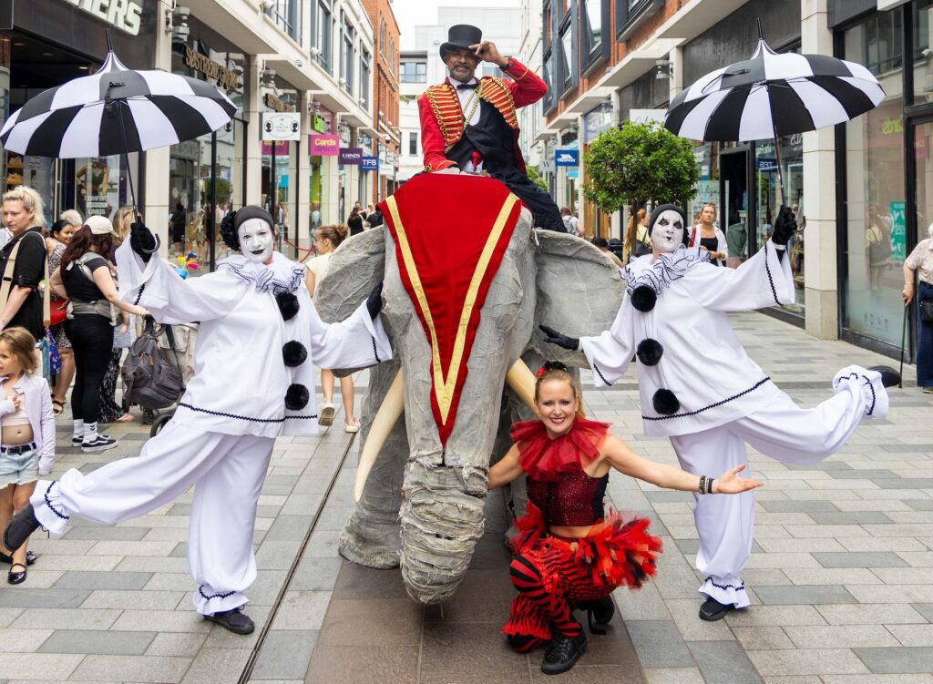 Elephants on Parade life-size elephant puppet with Pierrot Clowns